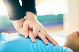 Cpr, first aid and healthcare with hands on chest of person for paramedic, medical and saving lives. Cardiac arrest, heart and injury with patient and compression for emergency, medicine and wellness cpr-training-seattle-3-300x200